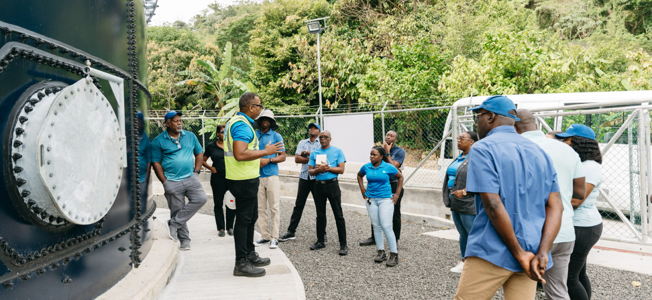 Study tour participants next to Tufton Hall tank in Grenada